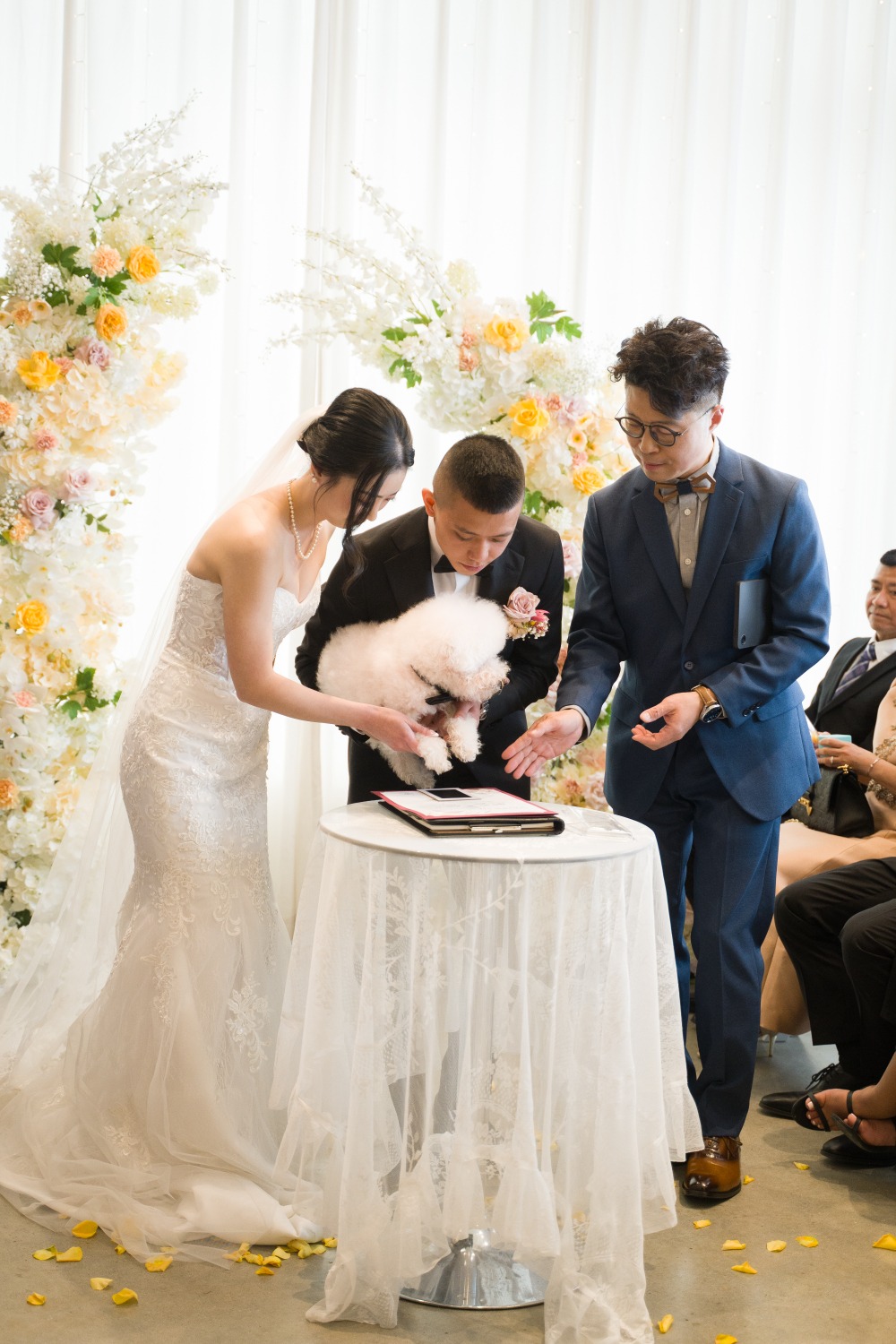 A couple and their dog creating a Paw Print Unity Certificate with their celebrant